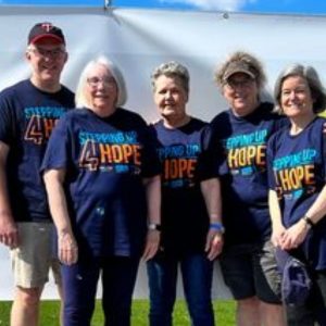 Chain of Lakes Church goers standing in front of wings at charity walk in Blaine, MN